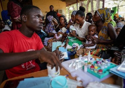 Vaccines being administered to children in a community clinic