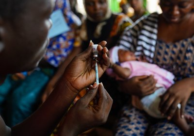 A Clinician preparing to administer a vaccine