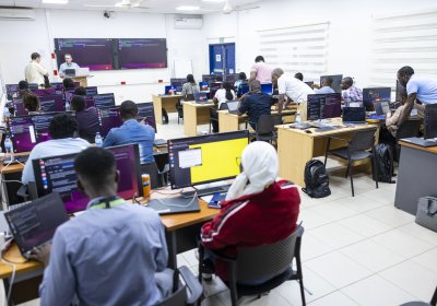Individuals undergoing ytraing in a seminar room