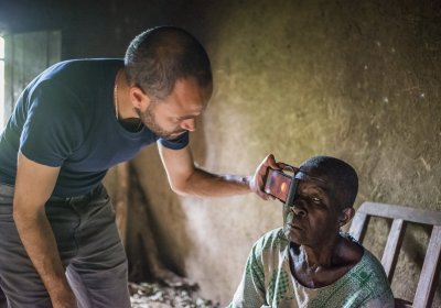 aption: Andrew Bastawrous uses the peek device to examine a Kenyan woman suffering from blindness. Credit: Rolex/Joan Bardeletti