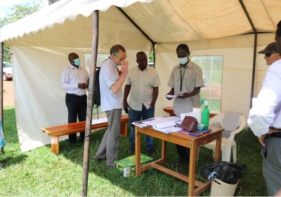 Prof. Liam Smeeth at the registration desk for study participants in Kyamulibwa, Uganda