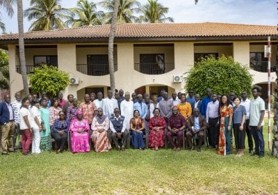 A professional group photograph of the meeting participants at Ocean Bay - The Gambia.