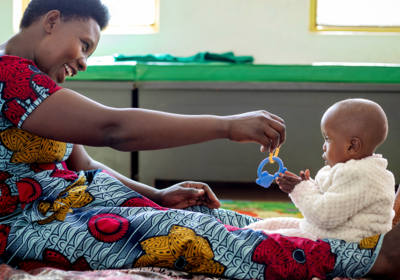 a mother playing with her young child