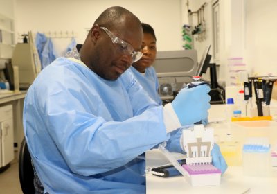 PhD student working in the molecular biology laboratory. Credit: Mamud Joof, MRC Gambia