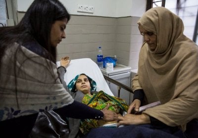 A woman is examined after childbirth at Holy Family Hospital, Rawalpindi. Credit: Saiyna Bashir © Wellcome Trust