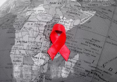 Red ribbon placed on a globe model
