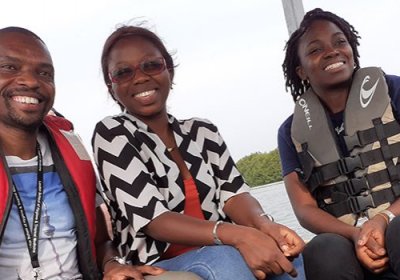 Students on a boat in The Gambia