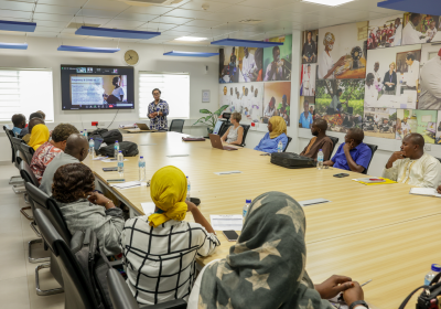 Individuals attending Vacsafe workshop in a meeting room