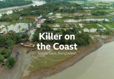 Image of a flooded coastland with a river winding in the background, fields covered in water, and the words &#039;Killer on the Coast&#039;, Sundarbans, Bangladesh