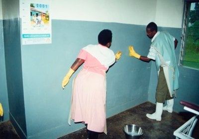Two cleaners washing the walls of a hospital