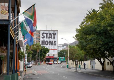 Stay at home poster in an empty street
