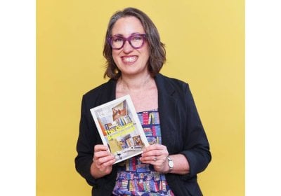 Layla McCay holding her book 'The Queer Bookshelf'