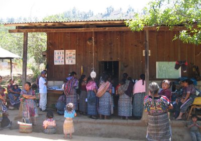Maya Guatemalan community members gather at a local health post