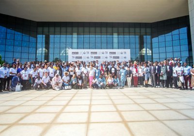Scientists, policymakers, students and partners pose for a group photo