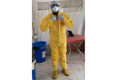 Reuben demonstrating donning and doffing complete PPE to staff in preparation for the outbreak of Lassa fever in Nigeria.