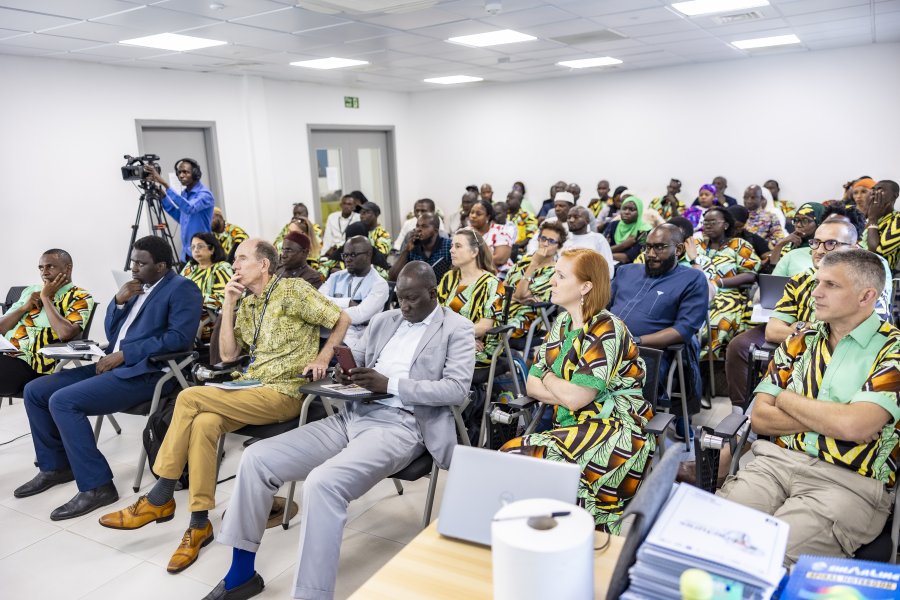 A group of people in a seminar room at MRCG 