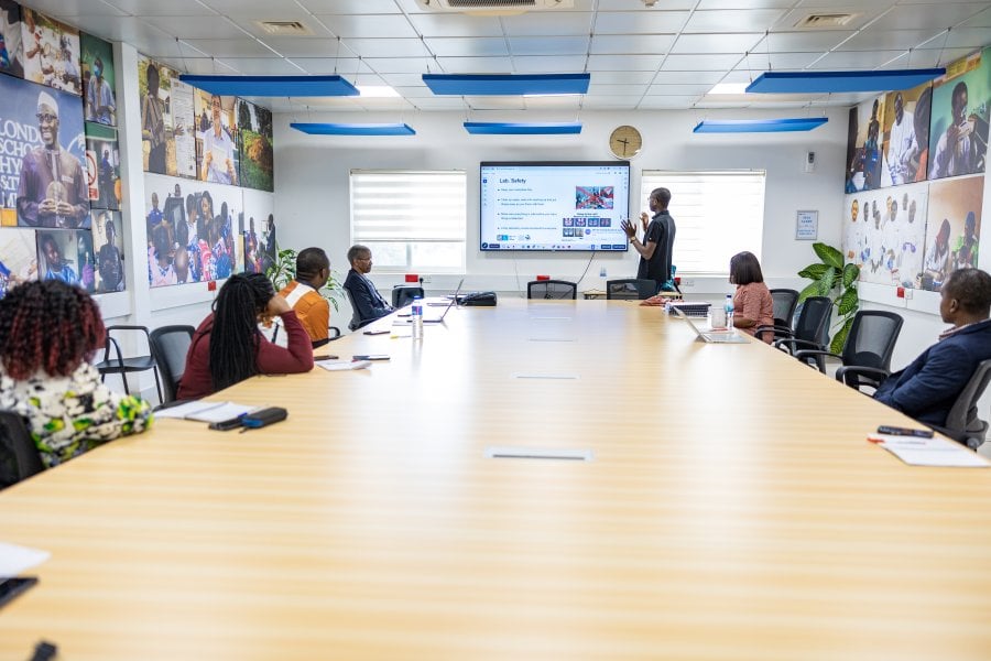 Individuals having a meeting in a seminar room
