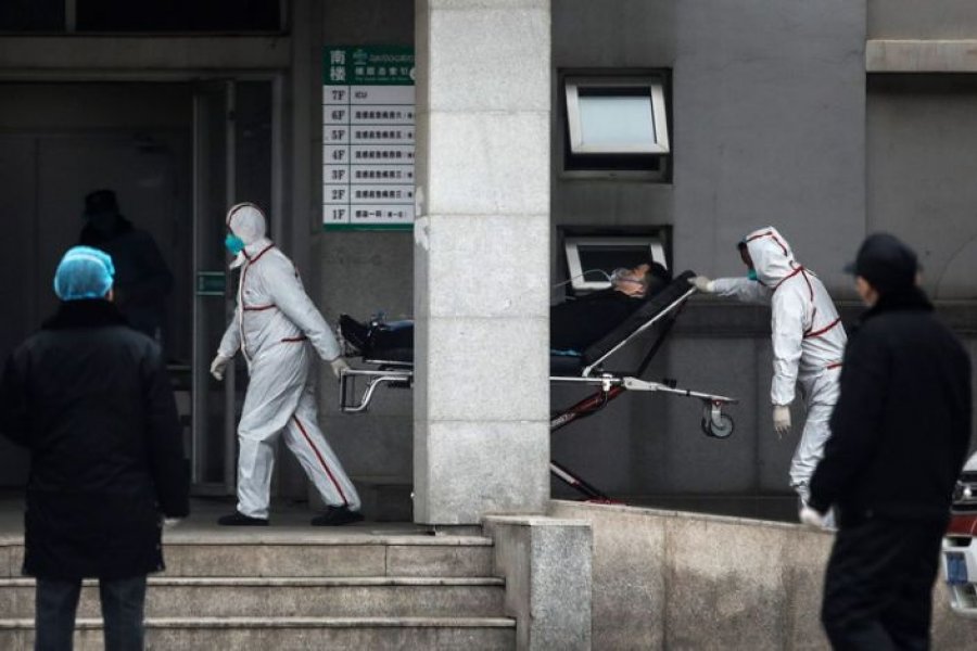 Medical staff transfer patients to Jin Yintan Hospital in Wuhan, Hubei. Credit: Flickr (Bruce Detorres)