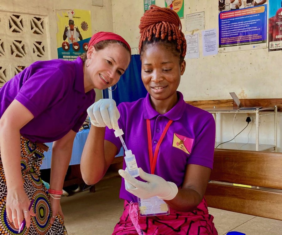 Amaya Bustinduy (left) training a Schista Community Worker on the use of rapid diagnostic tests for Trichomonas Vaginalis in the Schista study in Zambia
