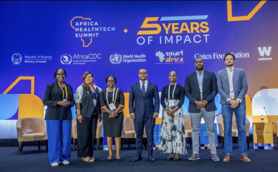 Dr Elizabeth Wangari Mwanika is photographed in a conference space with several other speakers for the 2026 Africa HealthTech Summit