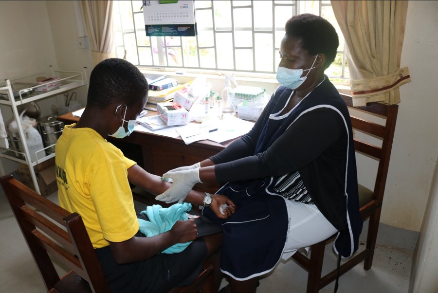Nurse attending to an adolescent at EMABs Clinic 