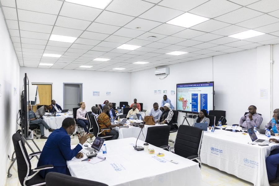 Individuals having discussions in a seminar room
