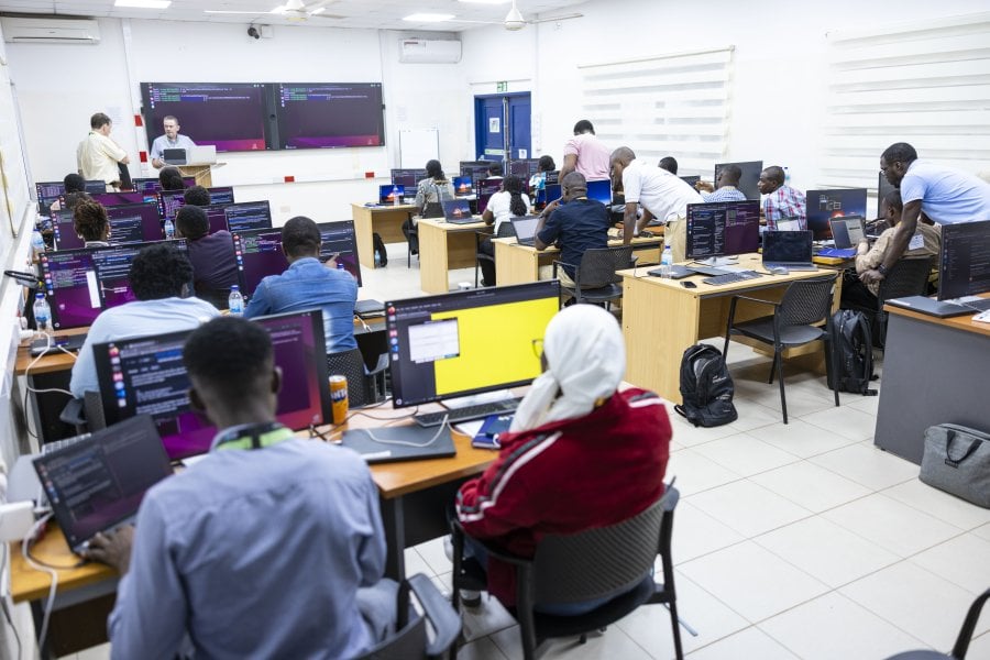Individuals undergoing ytraing in a seminar room