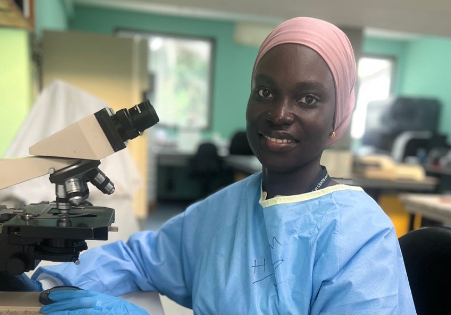 Haddijatou Mbye working at the MRC Gambia laboratory