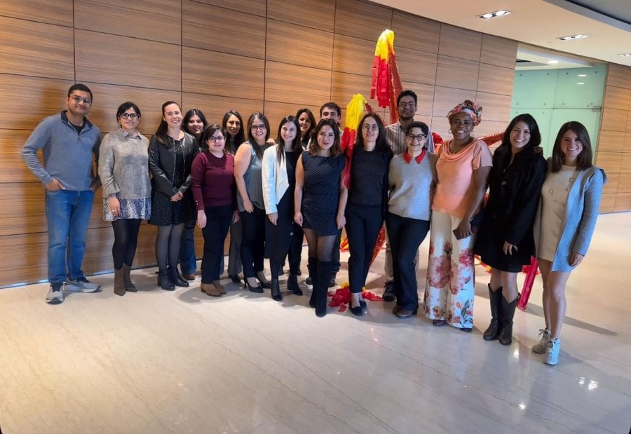 A line up of men and women in a conference centre