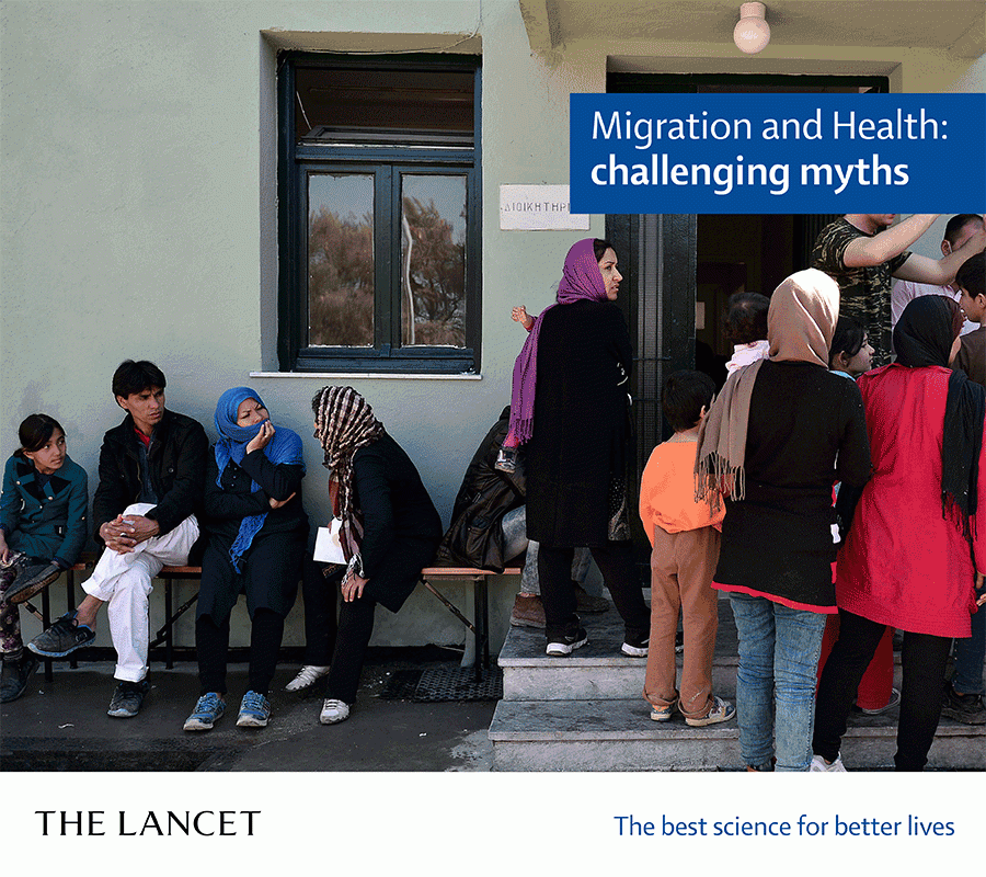 Caption: Migrants outside building. Credit: Lancet