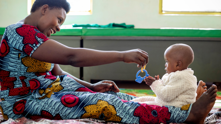 a mother playing with her young child