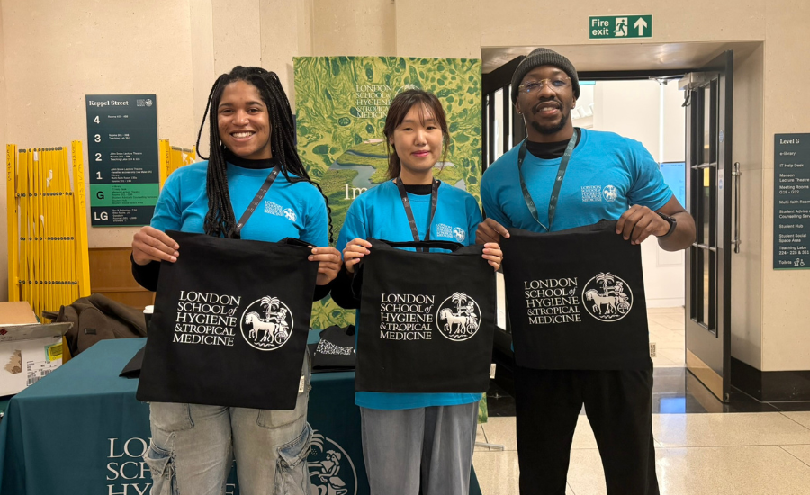 LSHTM Students holding LSHTM tote bags