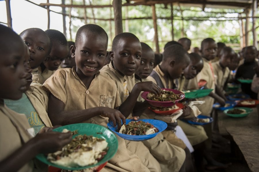 Children eating lunch at a primary school in Burundi