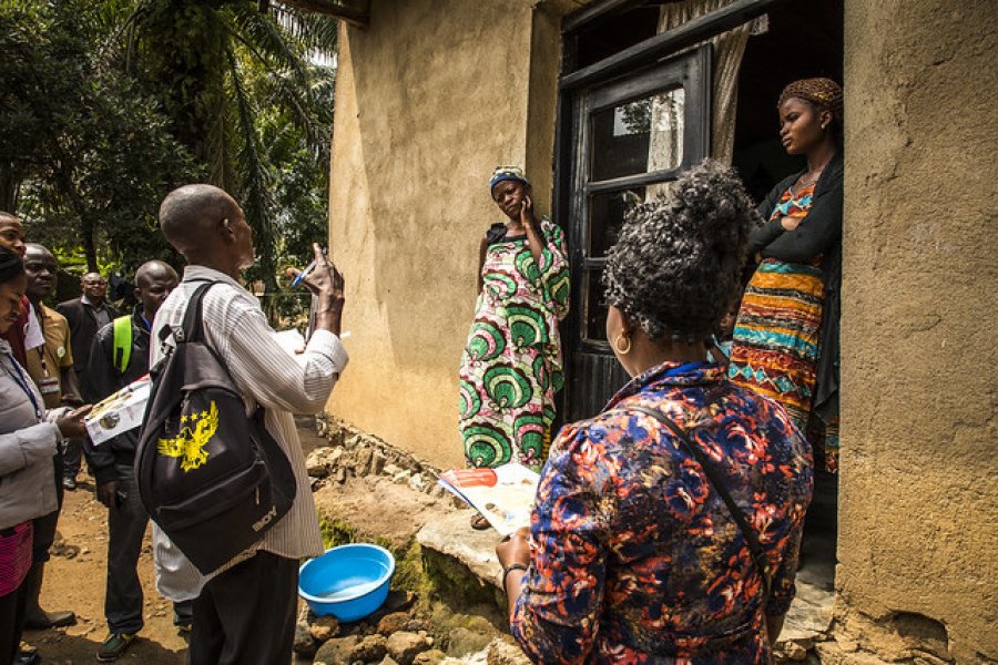 Caption: Community representatives visit family in Beni. Credit: World Bank/Vincent Tremeau