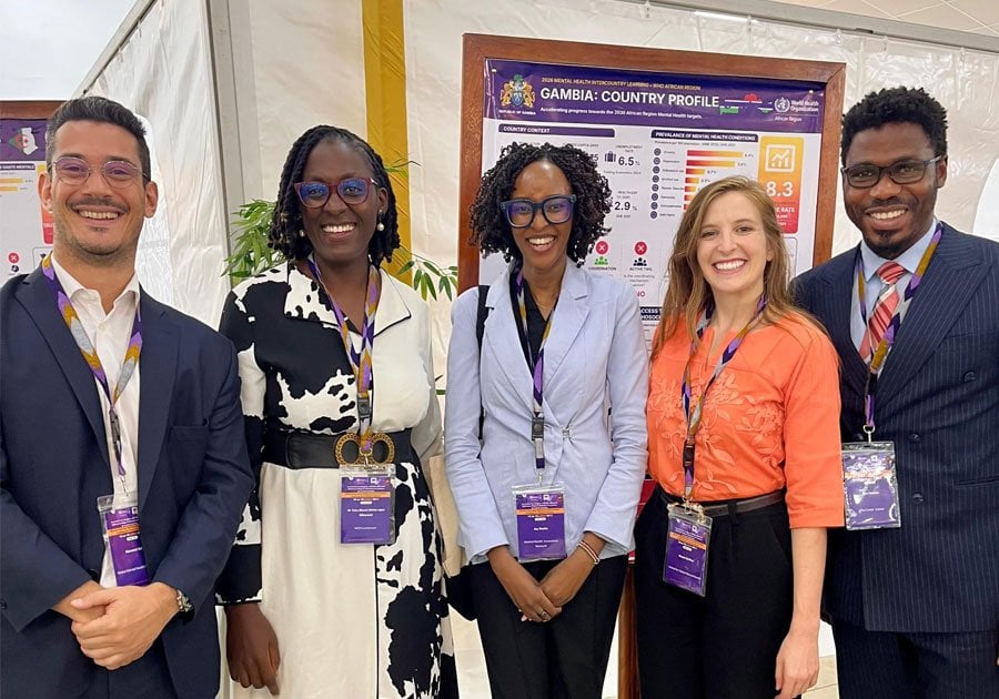 Giovanni, Alvine, Joy, Shayni, and Benedict standing together at [MS2.1]the WHO Intercountry Mental Health Meetings in Lomé, Togo.