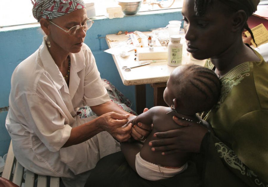 An infant receives treatment for malaria at a clinic in Mali