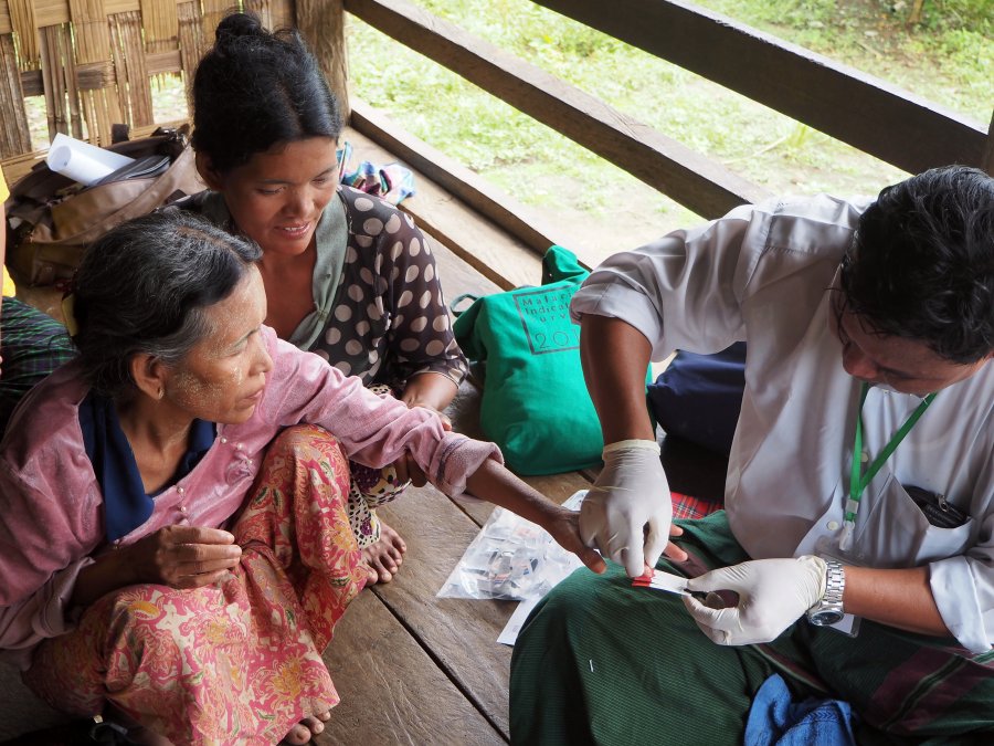 Woman getting tested for malaria in southeast asia