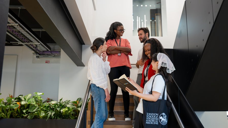 Student talking on the steps of Education Centre