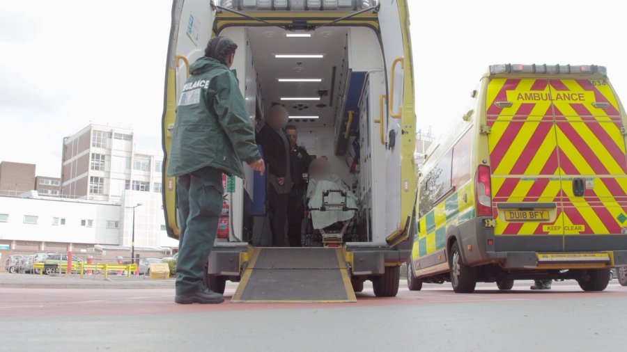 Paramedics preparing to bring a patient out the back of an ambulance at Queen Elizabeth Hospital, Birmingham. Credit: The Clinical Trials Unit, LSHTM.