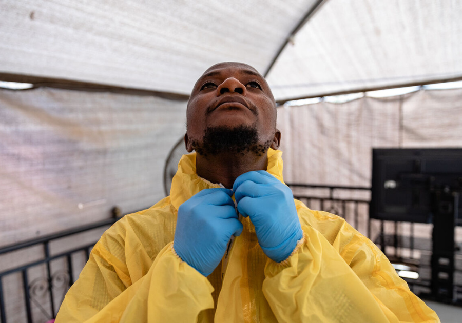 Demonstrating a correctly prepared personal protective equipment suit. Louis Leeson/LSHTM