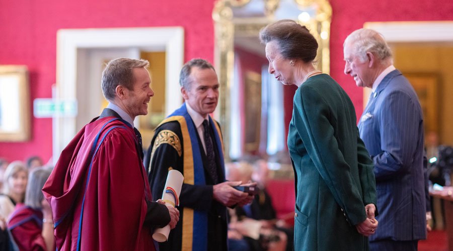 Professor Liam Smeeth and Professor John Edmunds receiving the Queen's Anniversary Prize 2022 from the Prince of Wales and the Princess Royal