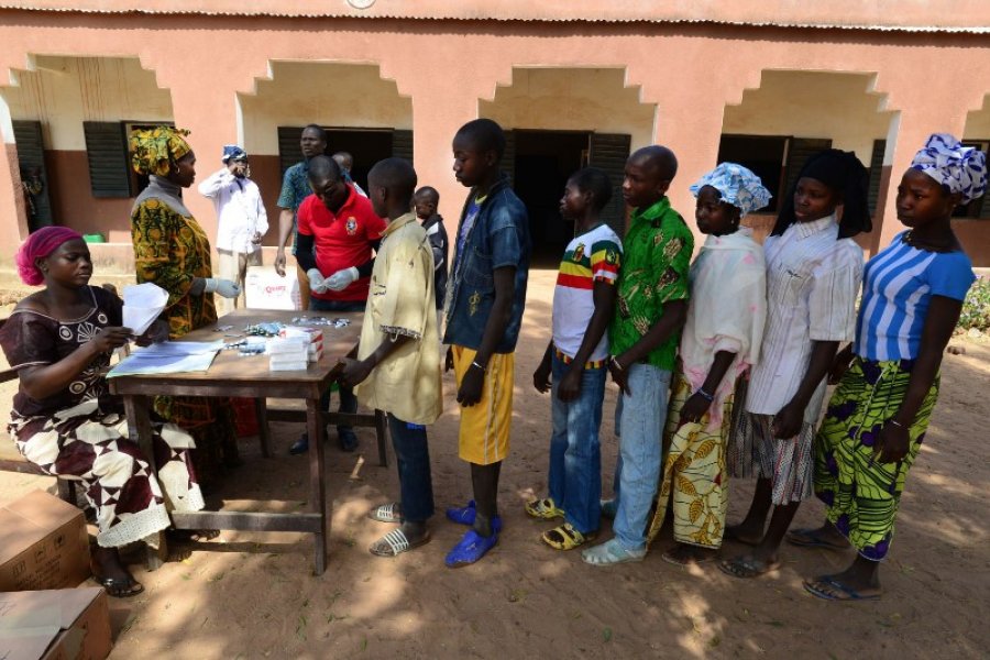 schoolchildren in Sikasso, Mali, receiving antimalaria drugs