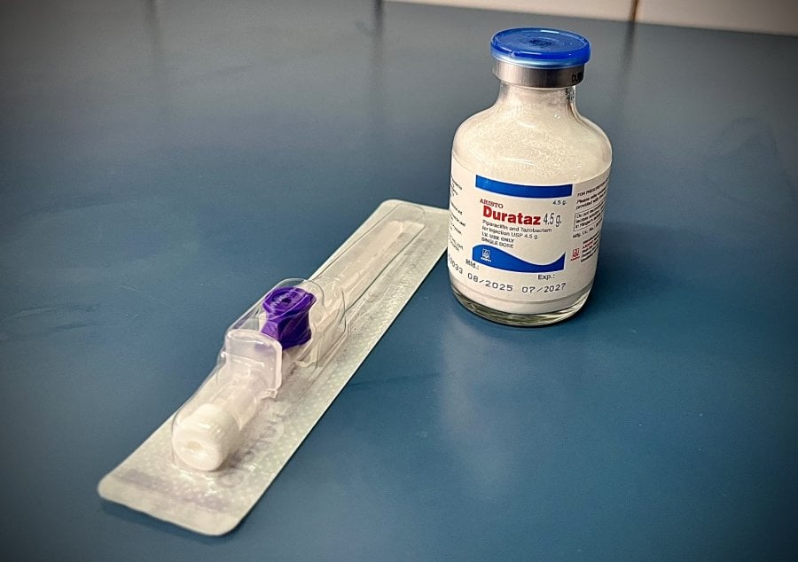 A syringe and a vial