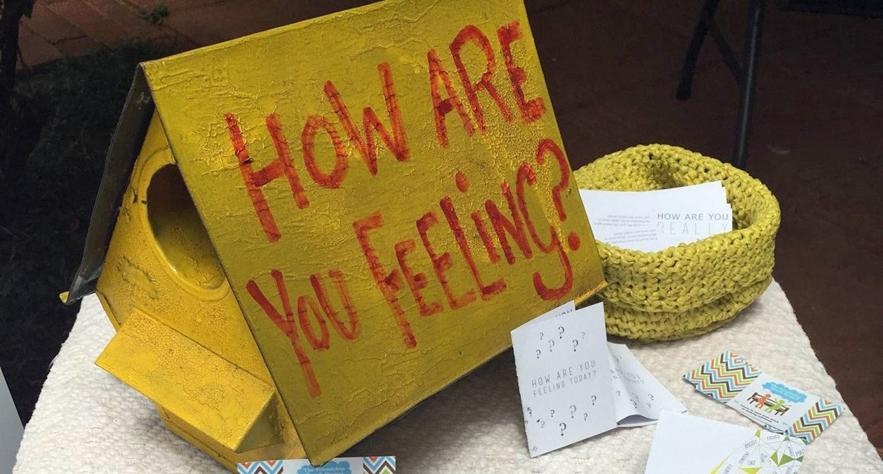 How are you feeling sign on a table