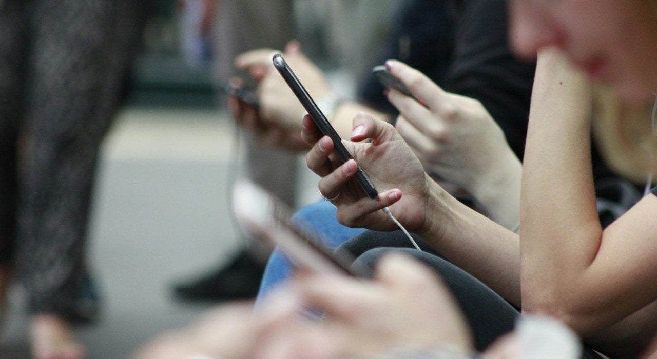 Zoomed in photo of a person holding a mobile phone