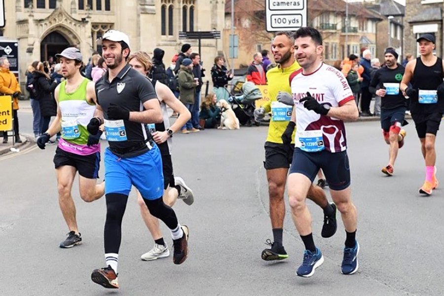 Former student Ismail Zoutat (blue shorts) representing LSHTM in Cambridge city centre