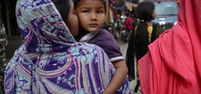 child held by mother