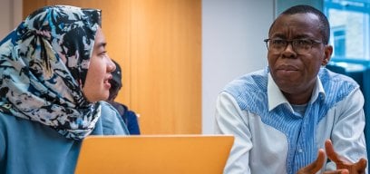 Students in a classroom talking to each other