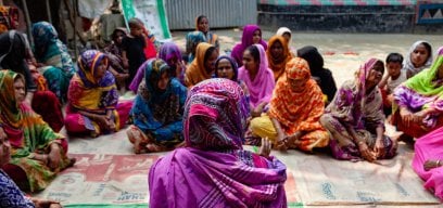 Group of women in meeting discussing health impacts of a Polio vaccination
