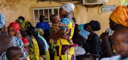 Women and their children in the humid vaccination ward at Basse Hospital